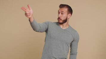 Man pointing around with finger gun gesture, making choice, shooting killing pistol right on target video
