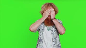 Afraid shocked young man closing eyes, confused shy scared reject to watch, phobia, shame, stress video