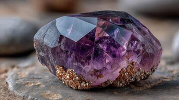 Stunning amethyst crystal resting on natural stone in a serene environment showcasing its vibrant purple hues photo