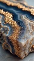 Stunning close-up of a blue and golden agate stone highlighting natural patterns and textures photo