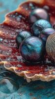 Unique dark spheres resting on a textured surface with glistening water droplets at a close-up angle photo