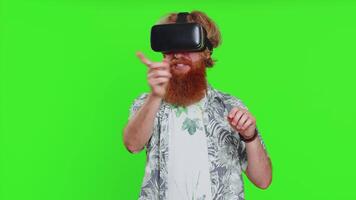 Excited man in VR headset helmet watching virtual reality 3D , playing simulation online game video