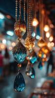 Colorful crystal ornaments displayed at a market during the evening hour photo