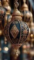 Decorative lantern hanging in a market showcasing intricate metalwork and detailed designs during the evening hours photo