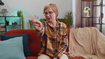 Displeased upset woman reacting to unpleasant awful idea, dismiss bad idea, wave hand, shake head No video