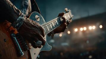 Guitarist performing passionately on stage during a live concert with vibrant lights in the background photo