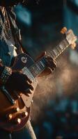 Live guitar performance under sunset lighting captures the passion and energy of the musician on stage photo