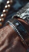 Elegant bracelet adorned with diamonds resting on a wrist during a formal event at sunset photo