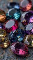 Vibrant collection of multicolored gemstones resting on a textured surface illuminated by soft light photo