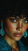 Model showcases striking blue eyes and bold earrings in a close-up portrait against a dark background photo