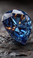 Beautiful blue diamond resting on an elegant wooden surface illuminated by soft ambient light creating a striking visual contrast photo