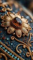 Intricate golden flower design embellished with gemstones on a textured blue background photo