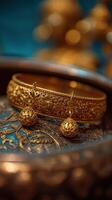 Intricate gold jewelry displayed elegantly on a decorative surface in a vibrant setting photo