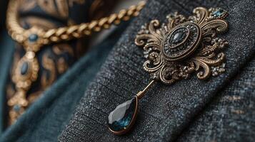 Intricate vintage brooch displayed on textured fabric with rich embroidery in the background during a fashion showcase photo