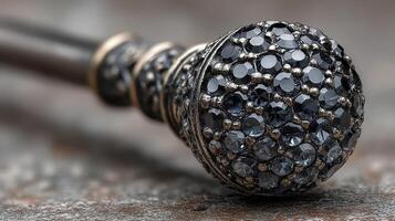 Intricate black gemstone hairpin resting on a textured surface with a touch of elegance and sophistication photo