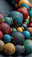 Colorful handmade necklace made with artistic beads in shades of red, blue, and gold during a close-up capture photo