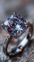 Stunning close-up of a sparkling gemstone ring showcasing intricate design and dazzling clarity on a textured surface photo