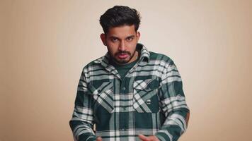 Puzzled clueless uncertain man raising hands in helpless, embarrassed confused by difficult question video