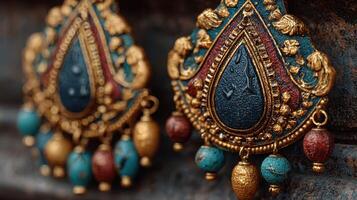 Intricate traditional earrings with colorful detailing displayed against a rustic background in a close-up shot photo