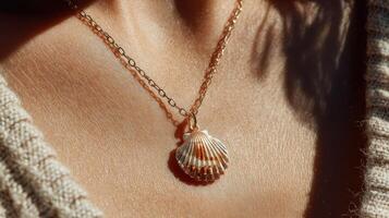 Shell pendant necklace glimmers in sunlight on a person's neckline during a warm afternoon photo