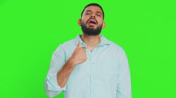 Happy Indian smiling man pointing finger to camera making winner choice, showing direction, select video