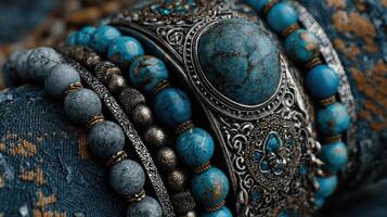 Colorful turquoise jewelry displayed on a textured surface showcasing intricate designs and details photo