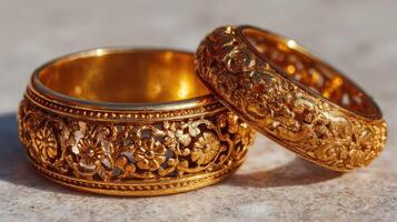 Intricate gold rings with floral designs displayed in natural light showcasing craftsmanship and elegance photo