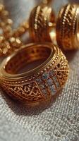 Intricate gold ring adorned with gemstones displayed on soft fabric background at a jewelry showcase photo