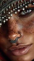 Close-up portrait of a person with intricate nose rings and unique beauty marks in natural light photo