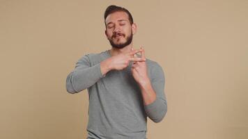 Man showing hashtag symbol with hands, likes tagged message, popular viral content, sign to follow video