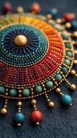 Handmade colorful decorative piece featuring intricate beadwork and metallic accents showcasing vibrant patterns and detailed craftsmanship photo