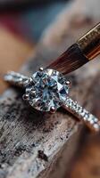 Close-up of a diamond engagement ring being cleaned and polished in a workshop setting photo