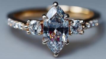 Elegant diamond ring with marquise center stone and round accents on a delicate band photo