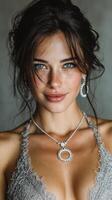 Glamorous portrait of a woman with striking blue eyes wearing elegant jewelry indoors photo