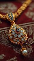 Elegant traditional necklace with intricate design and vibrant gemstones showcased on rich fabric background photo