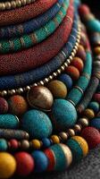 Colorful handmade jewelry displayed intricately with different textures and materials in a creative arrangement photo