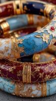 Colorful bangles with intricate designs displayed together in elegant arrangement photo