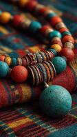 Colorful handmade jewelry displayed on traditional fabric in a warm setting highlighting artisan craftsmanship photo