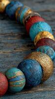 Colorful handmade wooden beads displayed on a rustic wooden surface, highlighting their unique textures and patterns photo