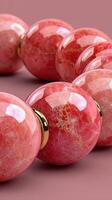 Elegant pink jewelry crafted from natural stone with glossy finish showcasing intricate patterns in close-up photo