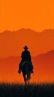 Silhouette of a rider on horseback against a vibrant sunset over distant mountains photo