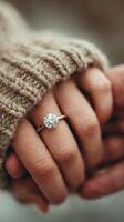 Engagement ring shines as couple holds hands in cozy sweater during autumn afternoon photo