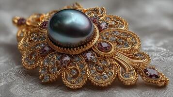 Elaborate vintage brooch with dark pearl and intricate gold filigree design on silk background photo