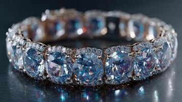 Elegant bracelet featuring sparkling blue gemstones displayed on a reflective surface in soft light photo
