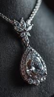 Elegant diamond pendant necklace displayed on a dark background highlighting its intricate design and brilliance photo