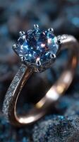 Sparkling blue gemstone ring displayed on textured surface with glimmering details in a detailed close-up photo
