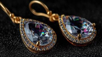 Elegant drop earrings with sparkling crystals displayed on a dark background showcasing intricate craftsmanship and design details photo