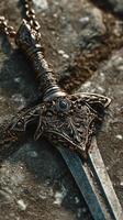 Intricate antique dagger rests on a weathered stone surface during golden hour light photo