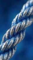 Blue and silver twisted rope showcasing texture and detail in a close-up view photo