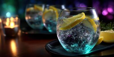 Refreshing drinks with ice and lemon served on a tray in a cozy ambiance during an evening gathering photo